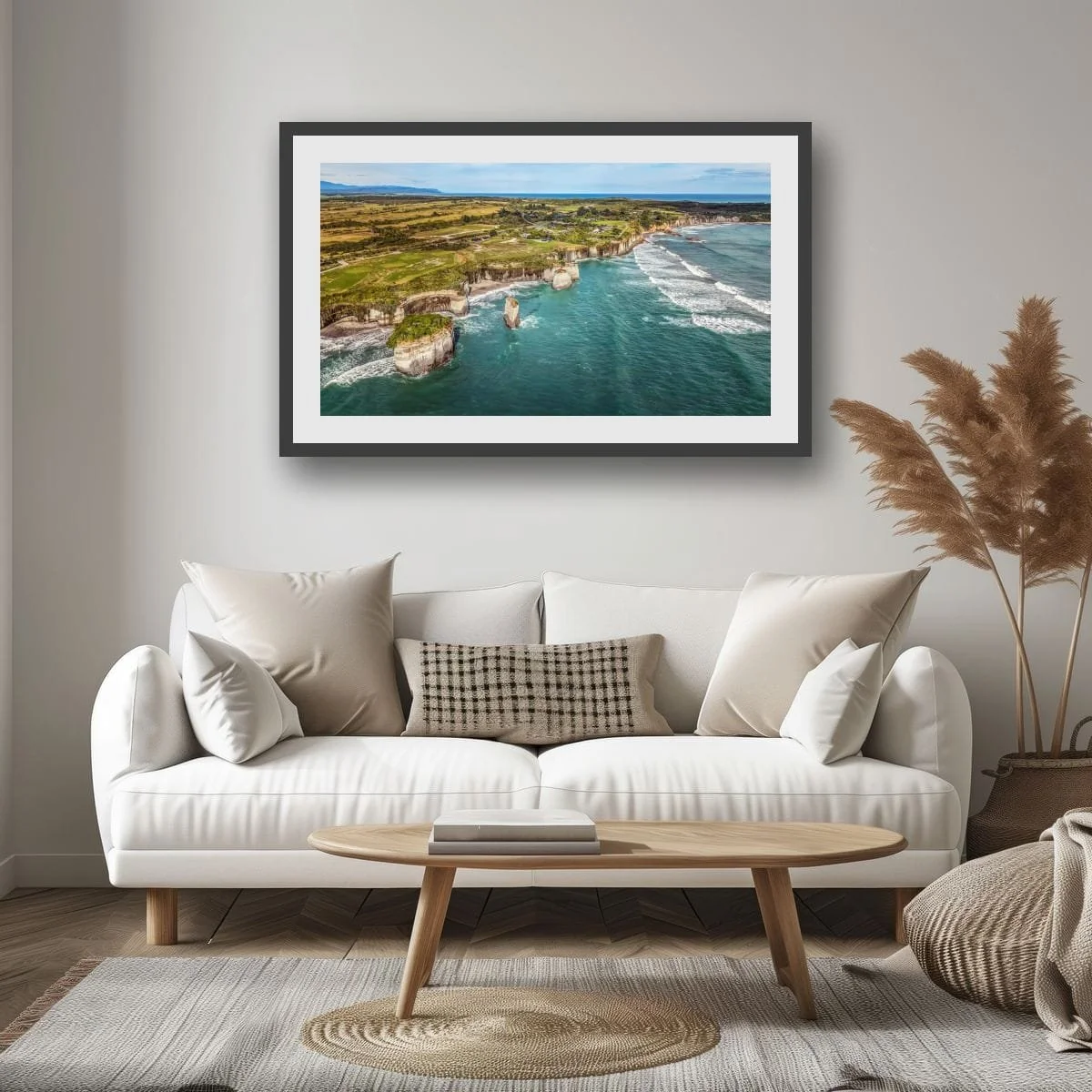 Aerial view of West Coast cliffs and ocean waves along the shoreline.