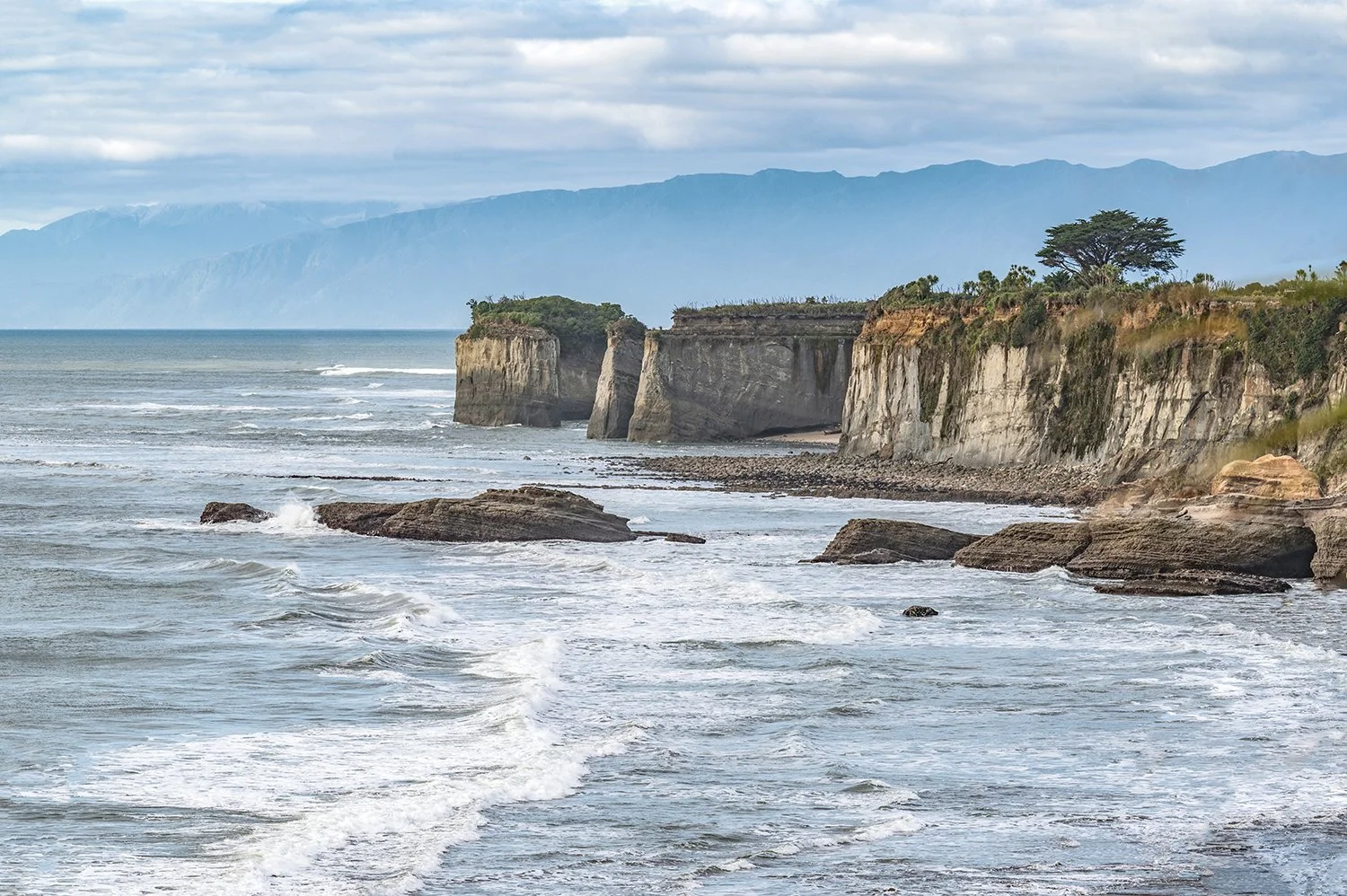 Cliffs towering above the Tasman Sea on the West Coast.