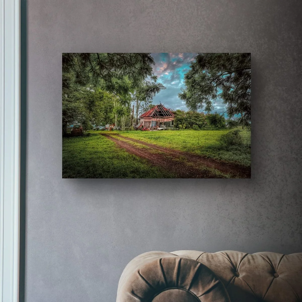 Abandoned rural homestead surrounded by trees and grassland.