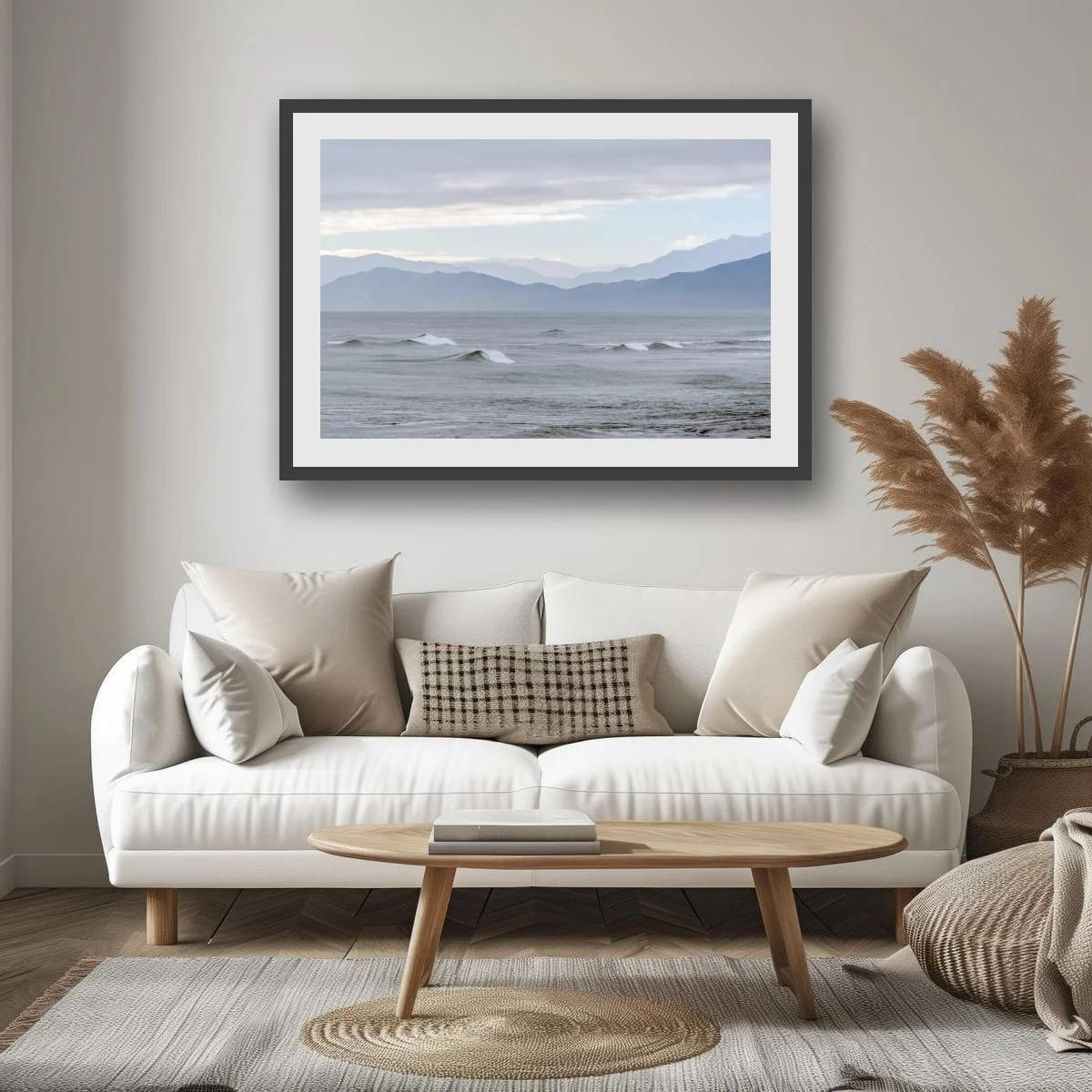 Rolling waves with layered mountain ranges on the West Coast.