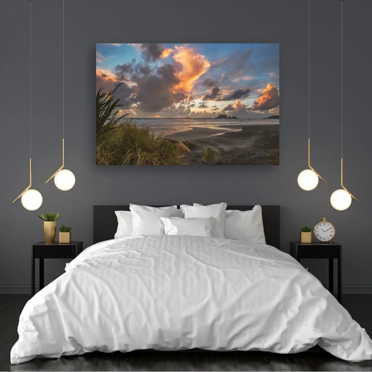 Golden sunset clouds above a West Coast beach with flax, wet sand, ocean waves and rocky sea stacks.