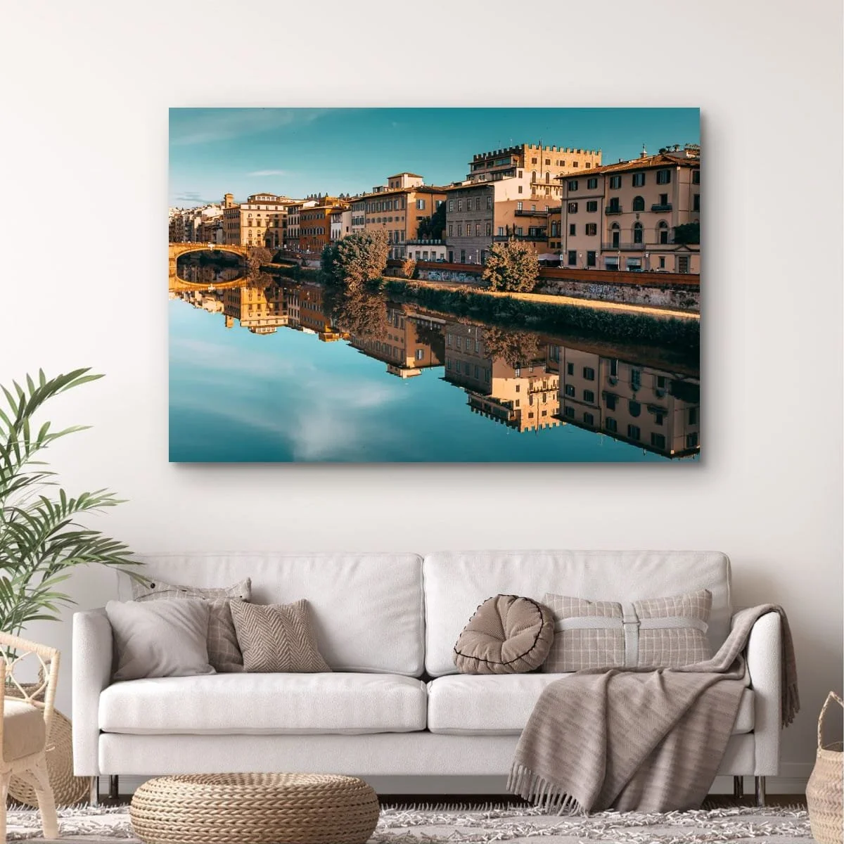 Historic Florence buildings reflected in calm river water.