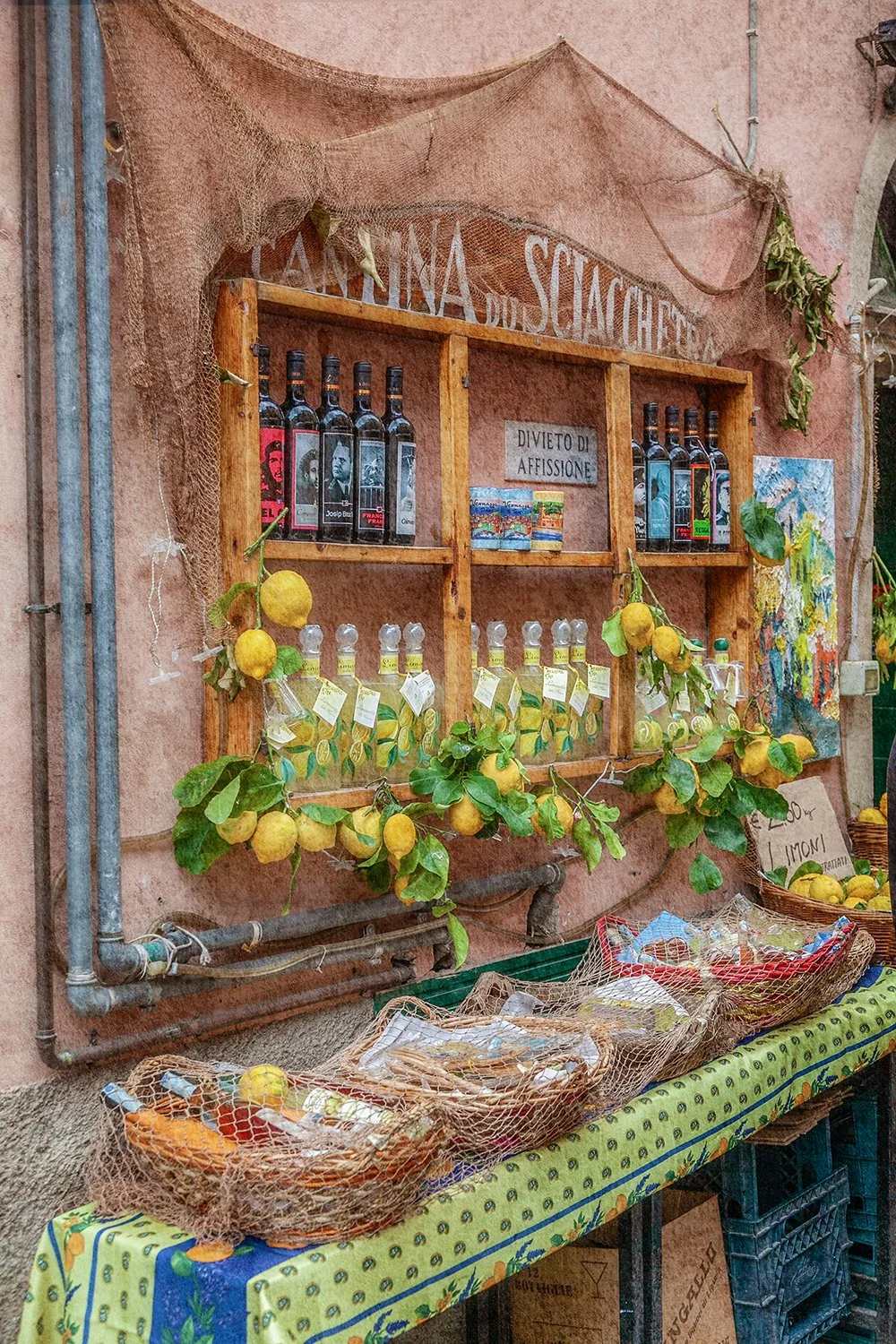 Italian market display with lemons and local produce.