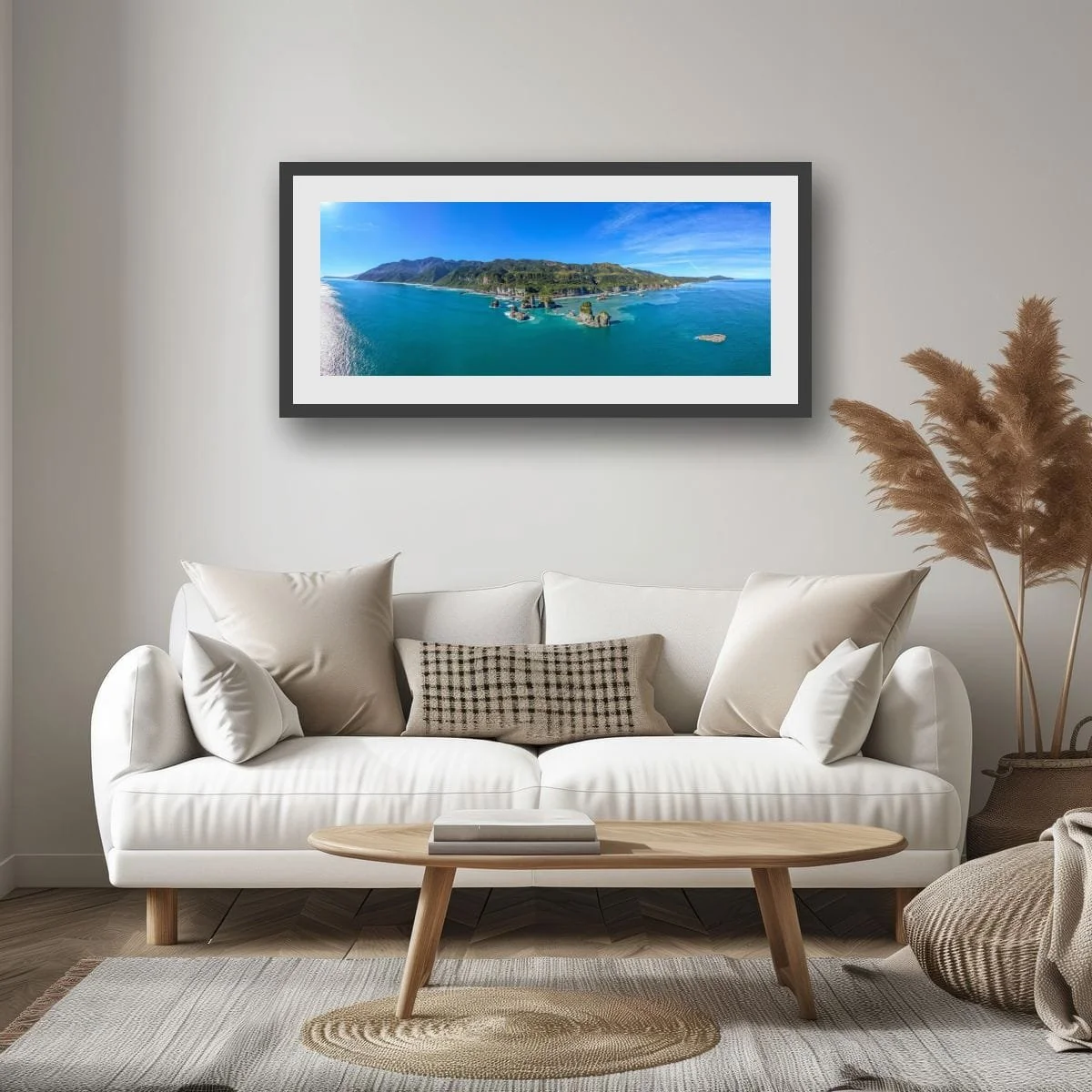 Aerial panorama of West Coast sea stacks, coastline and native forest.