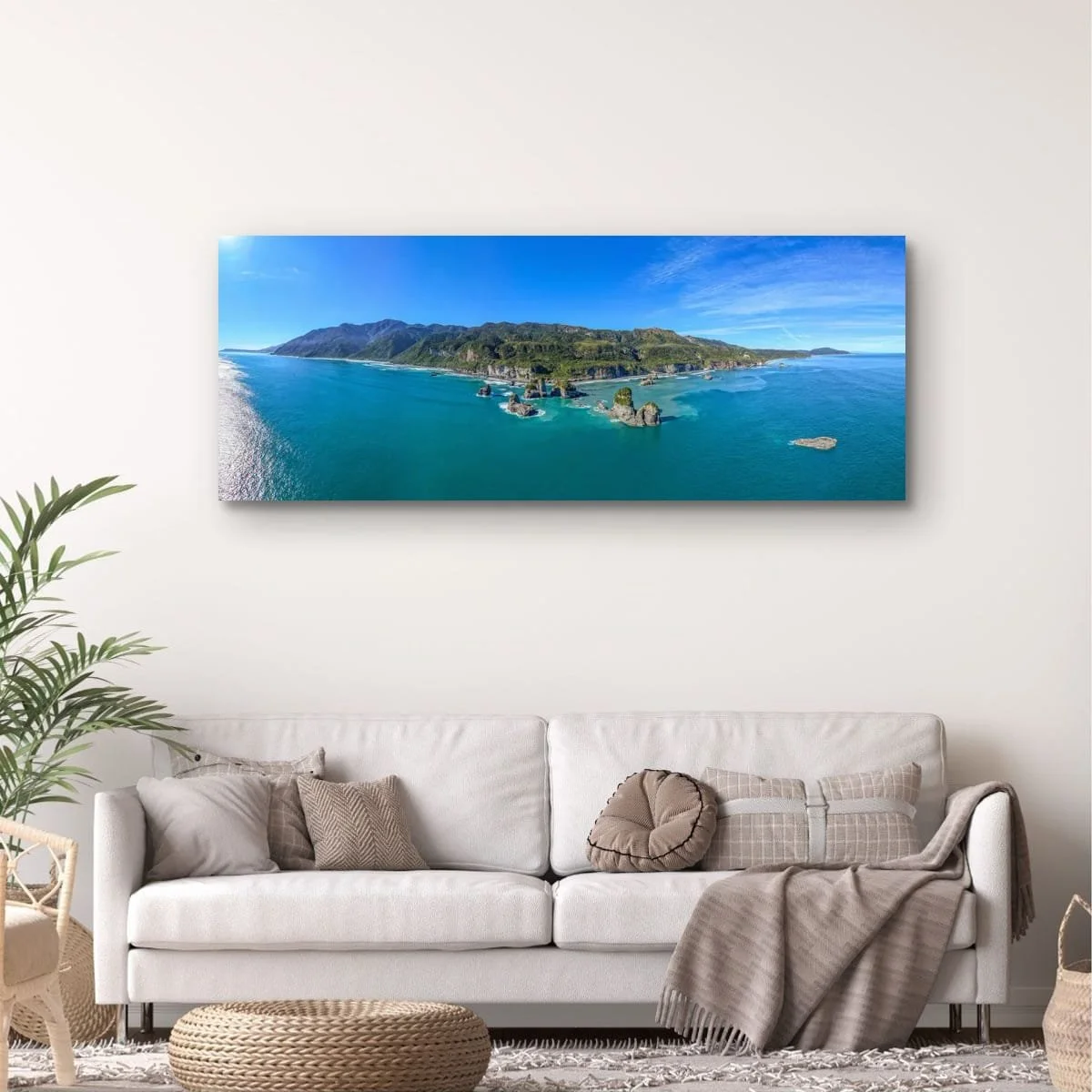 Aerial panorama of West Coast sea stacks, coastline and native forest.