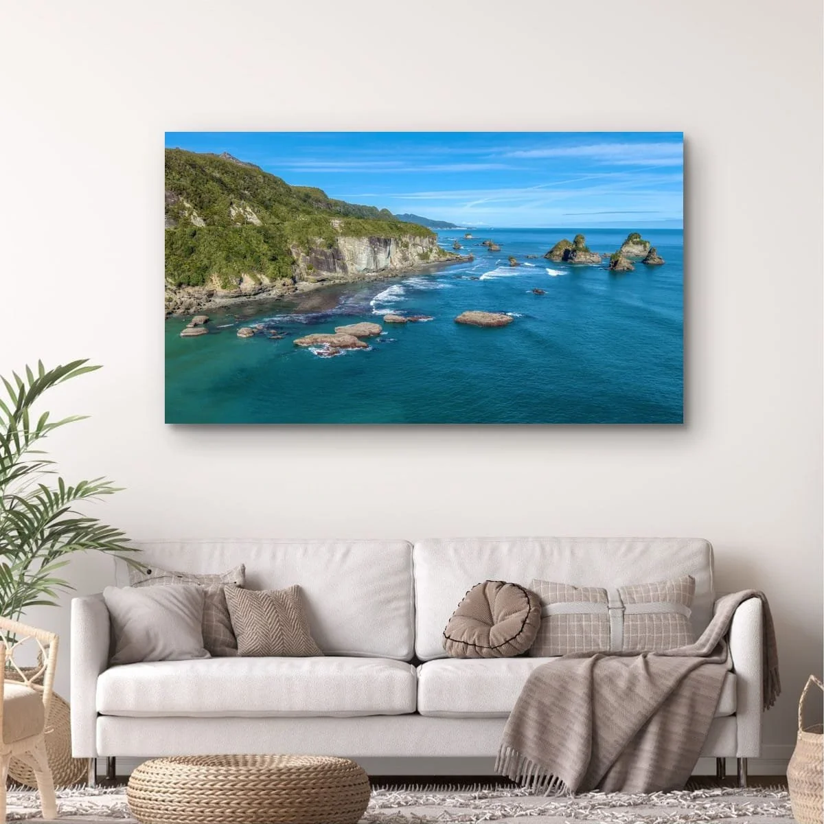 Aerial coastal view of West Coast cliffs and sea stacks.