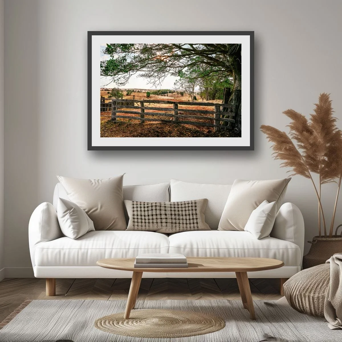 Weathered timber fence overlooking rolling rural hills.