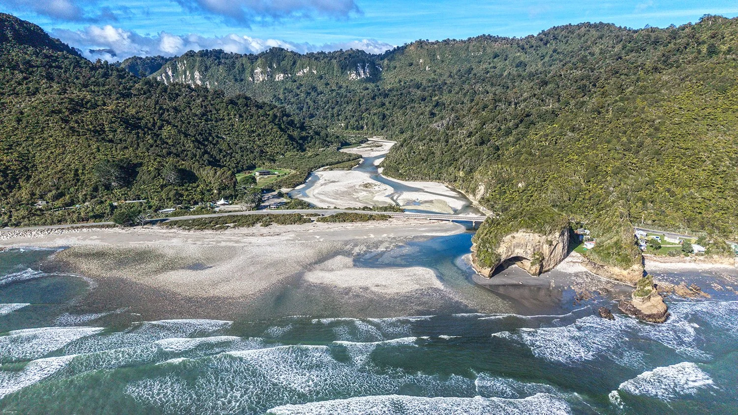 Aerial view of river channels flowing through a coastal gravel bed.
