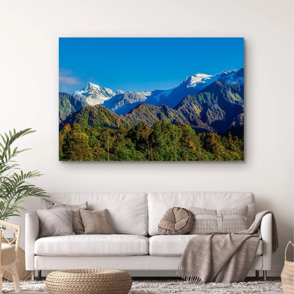 Aoraki Mount Cook rising above forested foothills and alpine peaks.