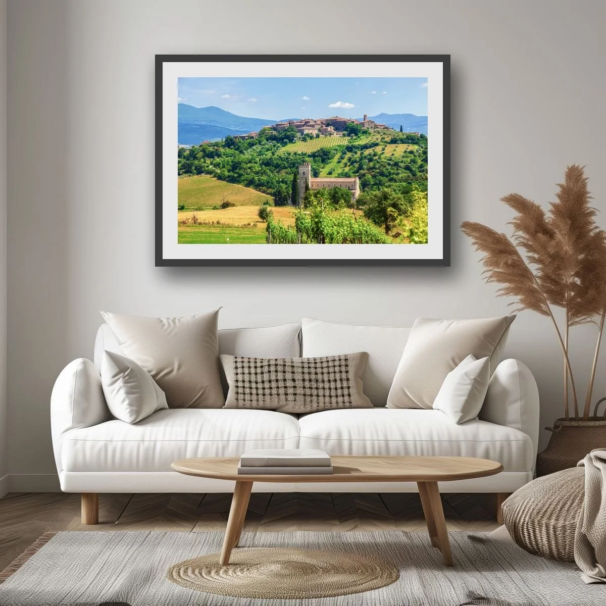 Tuscan hilltop village overlooking vineyards and countryside.