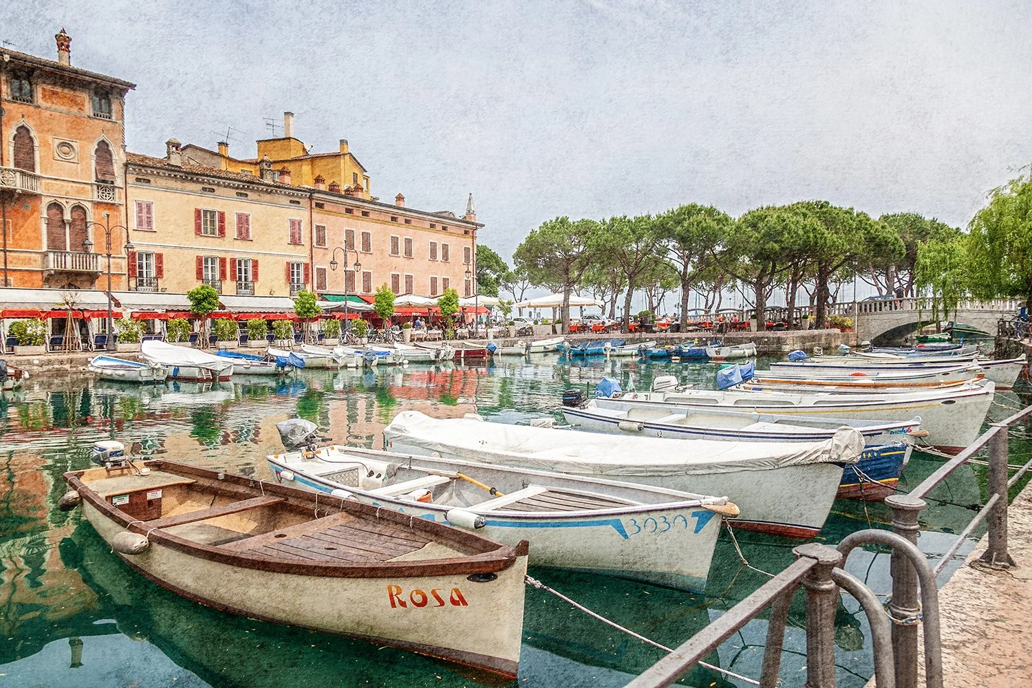 Boats moored along an Italian waterfront