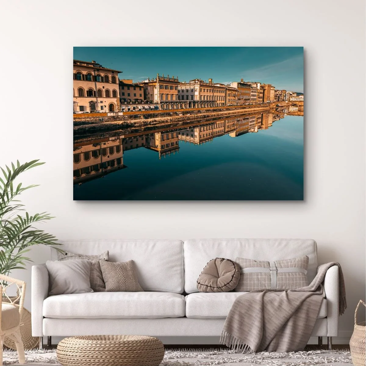 Florence cityscape with river reflections under warm evening light.