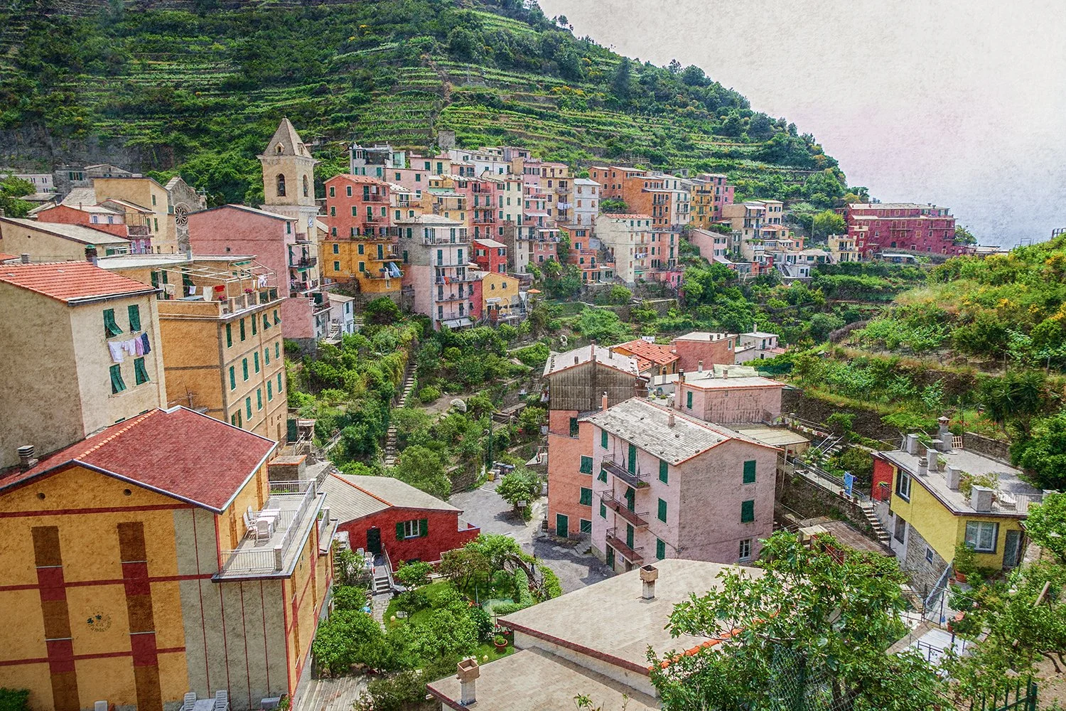 Colourful hillside village with terraces and gardens in Italy.