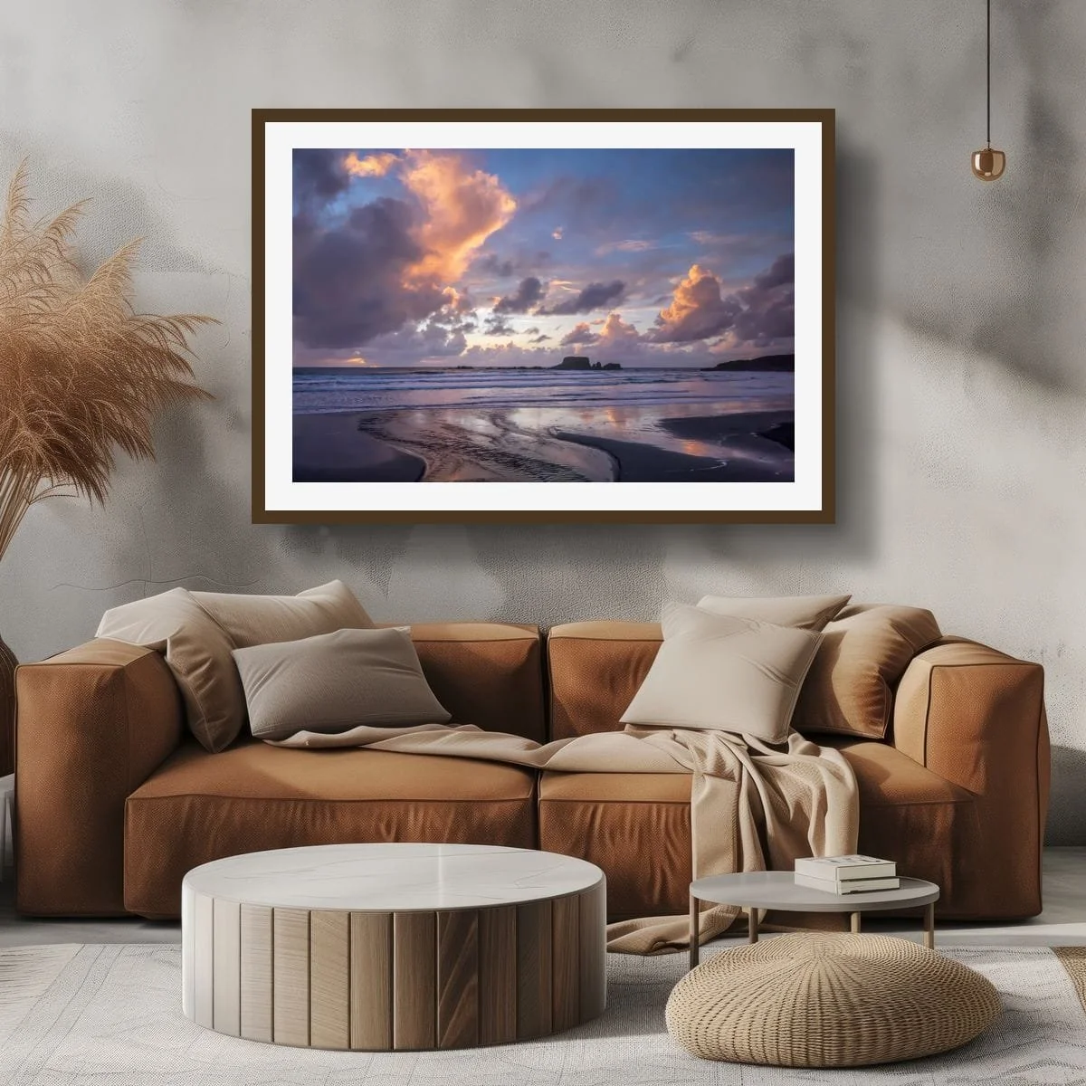 Pastel pink and violet dusk clouds reflected on a West Coast beach with ocean waves and dark sea stacks.