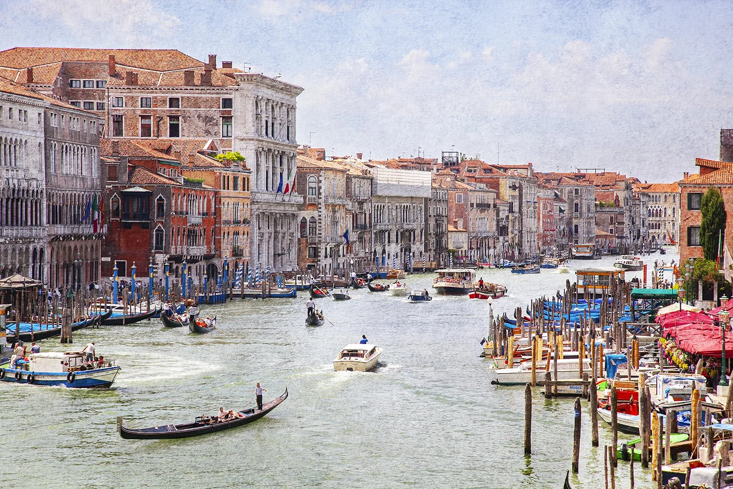 Venice Grand Canal with boats and historic buildings.