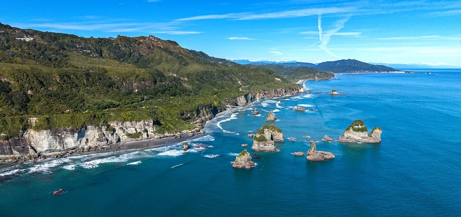 Aerial view of Motukiekie shoreline with sea stacks and coastline.
