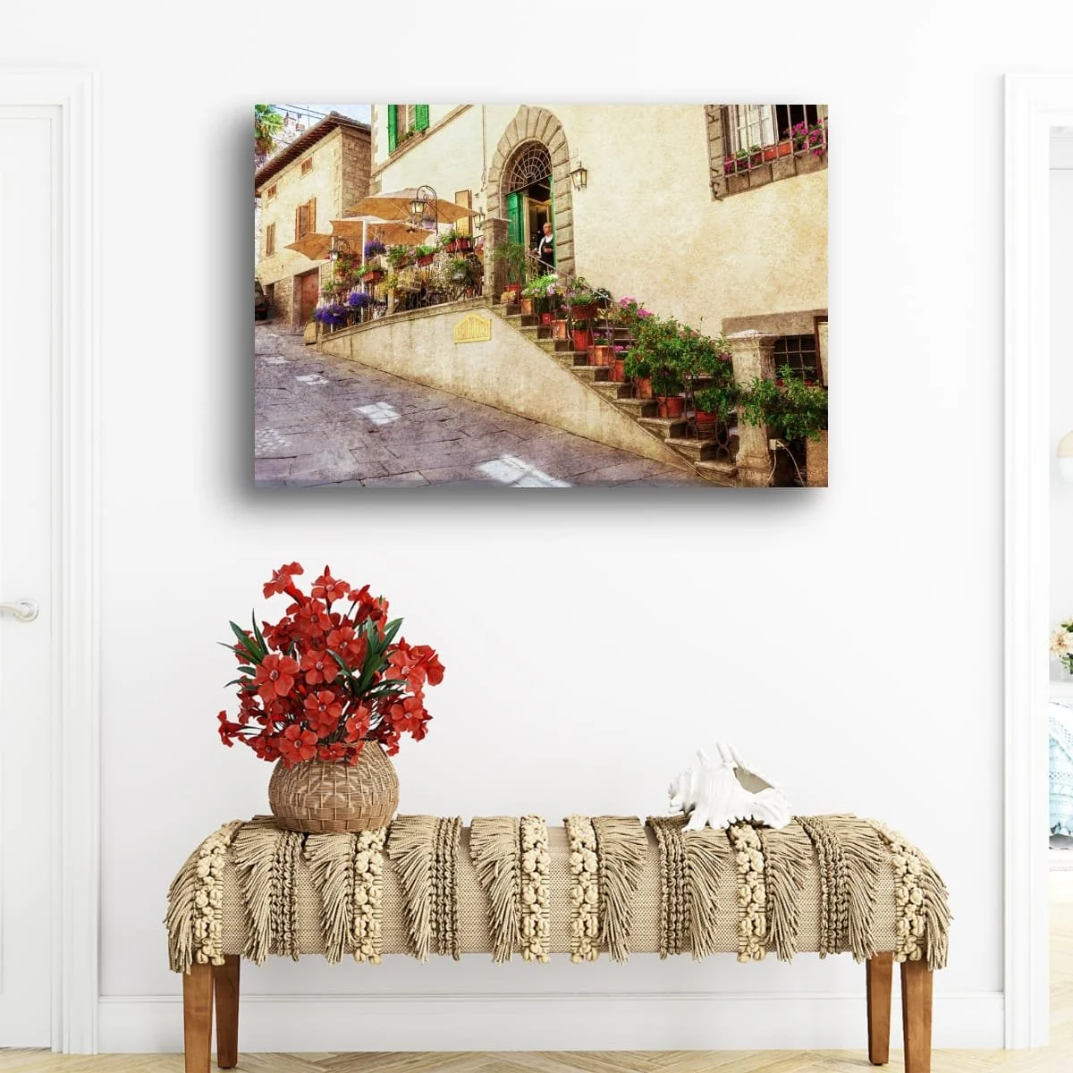 Traditional Italian osteria with flower-lined staircase and stone facade.