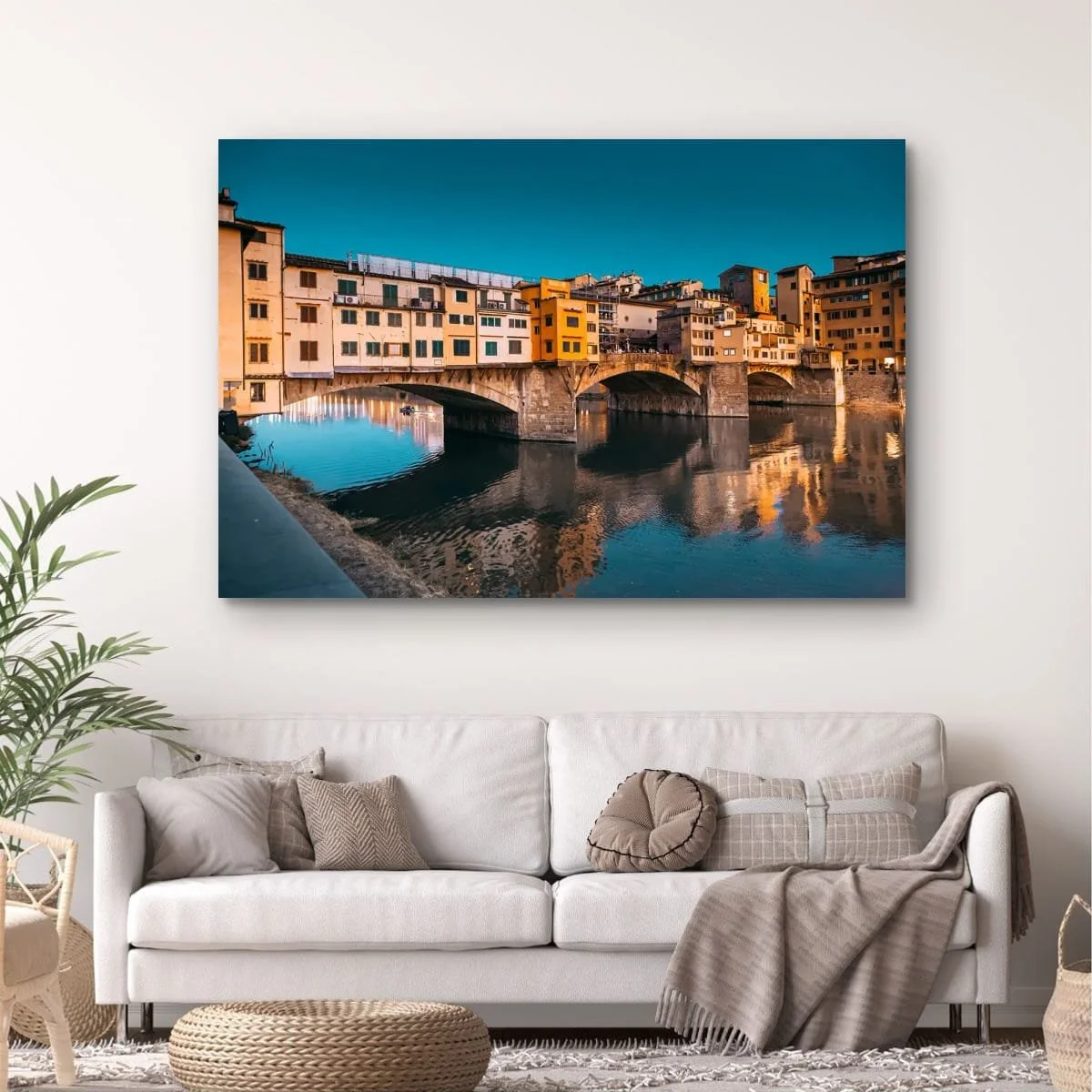 Ponte Vecchio bridge reflected in the Arno River at dusk.