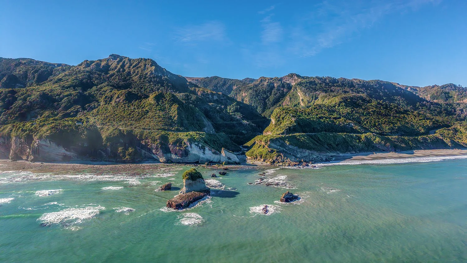 Aerial view of West Coast cliffs and sea stacks.