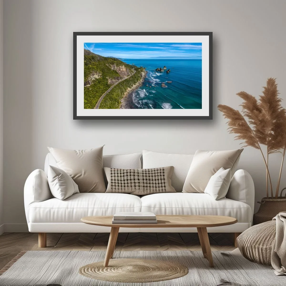 Coastal road winding beside sea stacks and ocean on the West Coast.