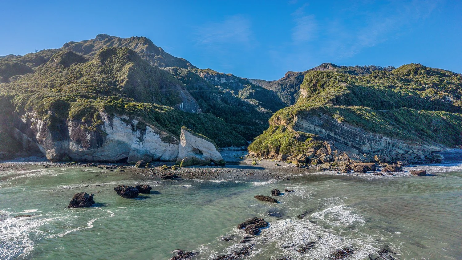 Ten Mile Creek valley surrounded by steep coastal hills.
