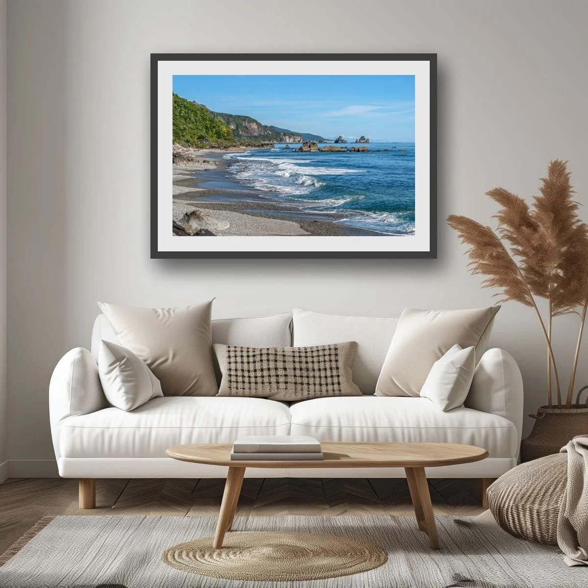 West Coast shoreline with waves, sea stacks and distant mountains.