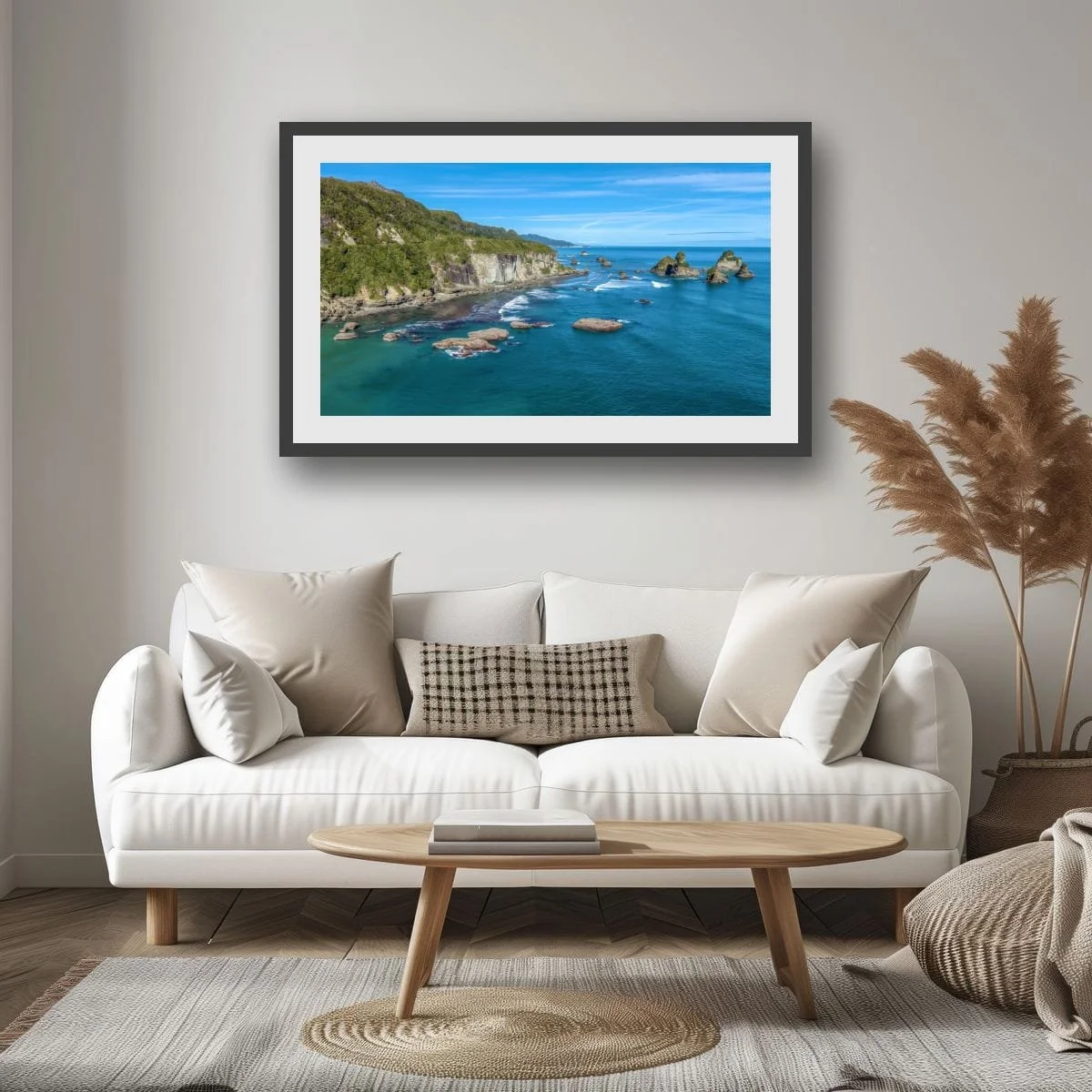 Aerial coastal view of West Coast cliffs and sea stacks.