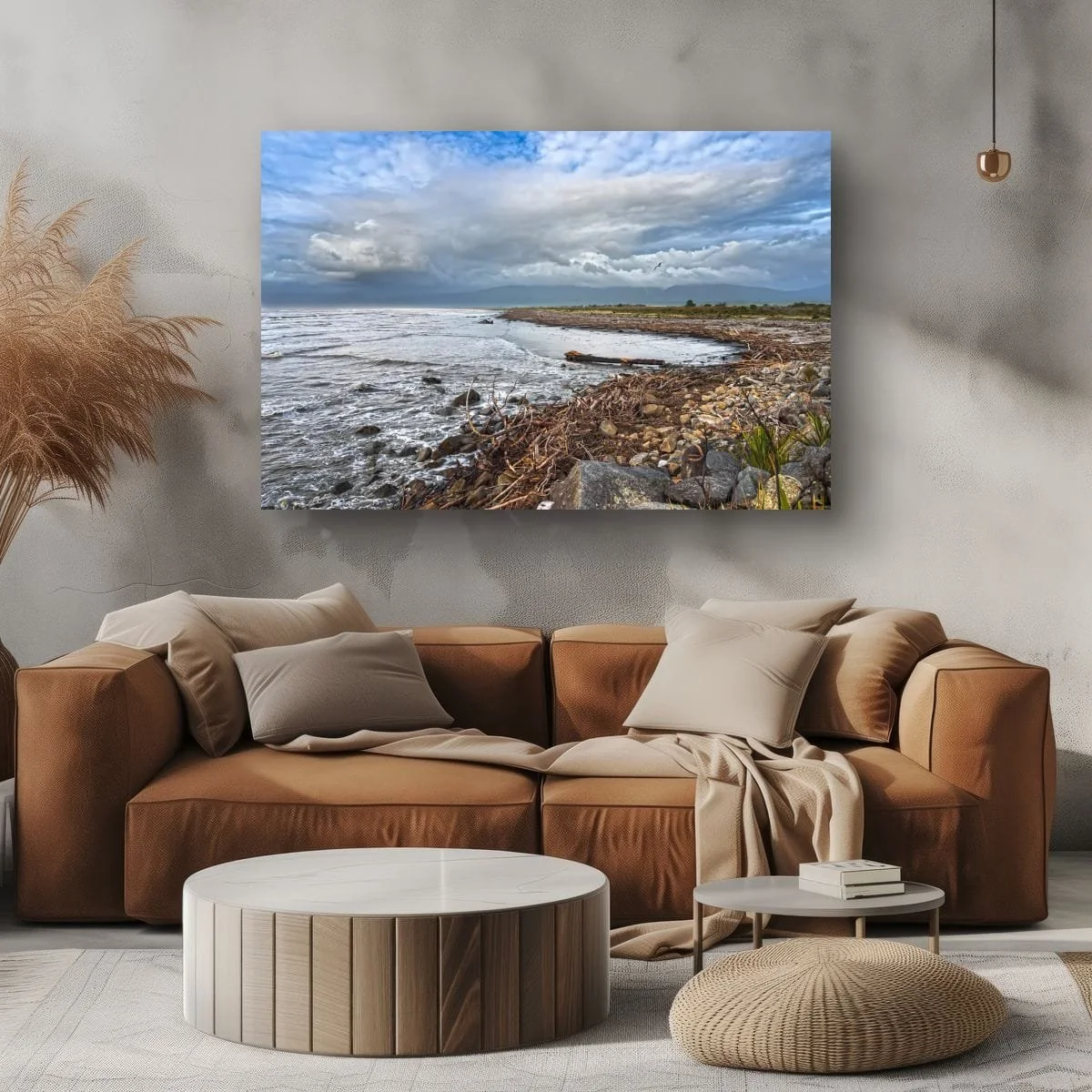 Fine art coastal photograph featuring driftwood, rocky shoreline and dramatic clouds along the New Zealand West Coast.