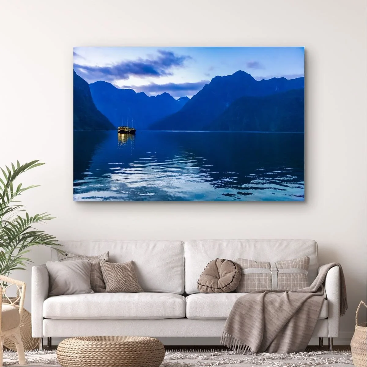 Boat illuminated on Milford Sound during blue hour.