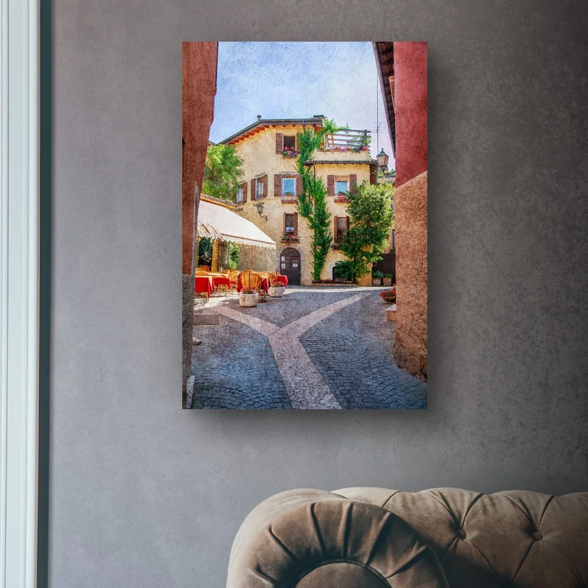 Italian terrace framed by historic buildings and flowers.