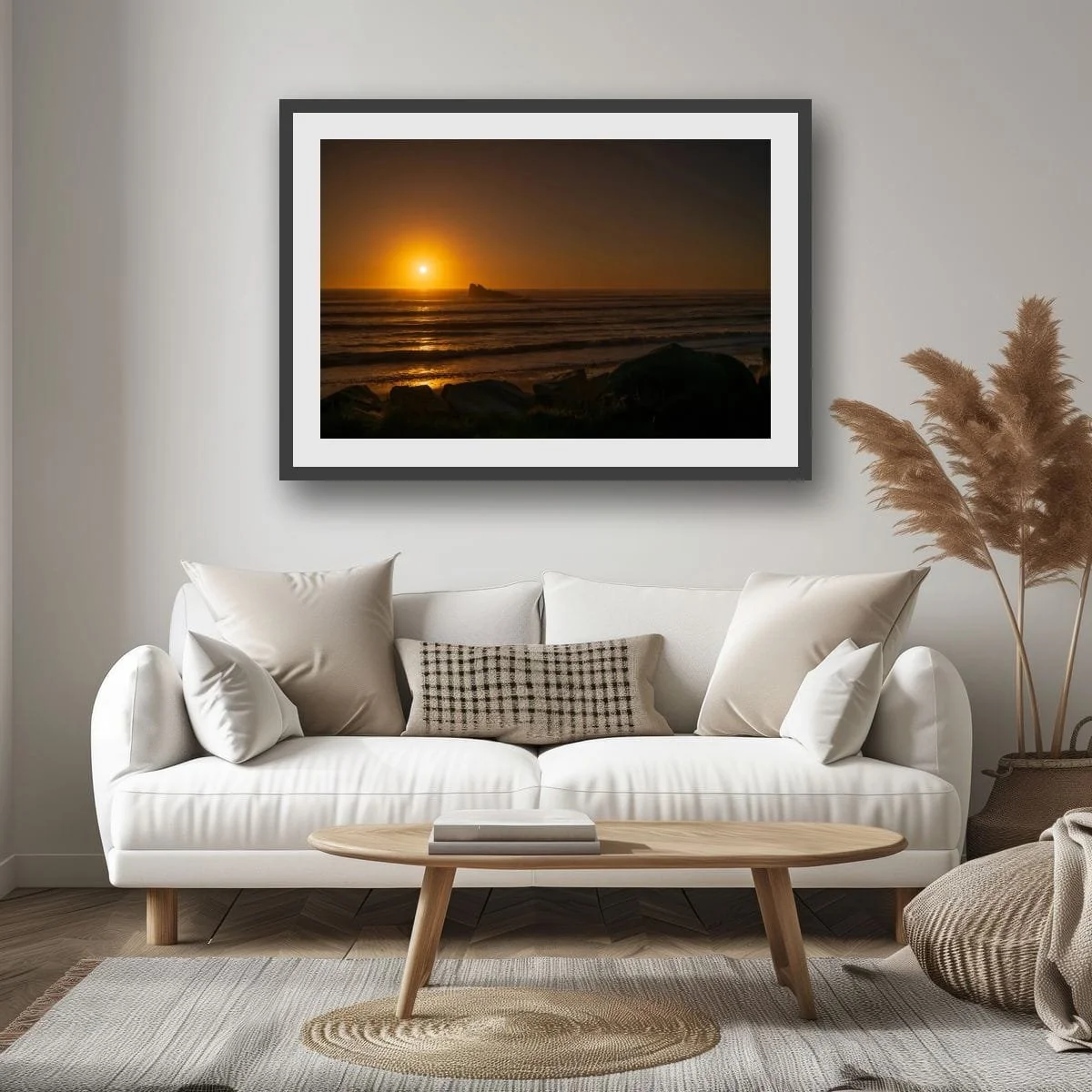 Golden sunset reflecting across the Tasman Sea with offshore rock formation.
