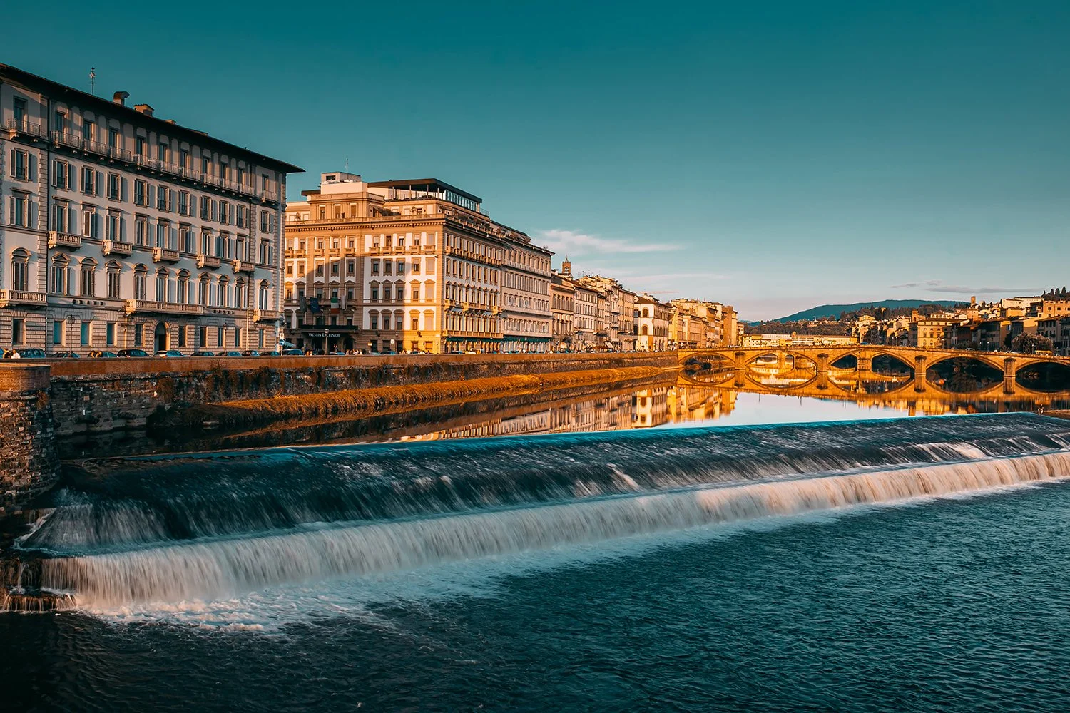 Florence cityscape reflected in the River Arno