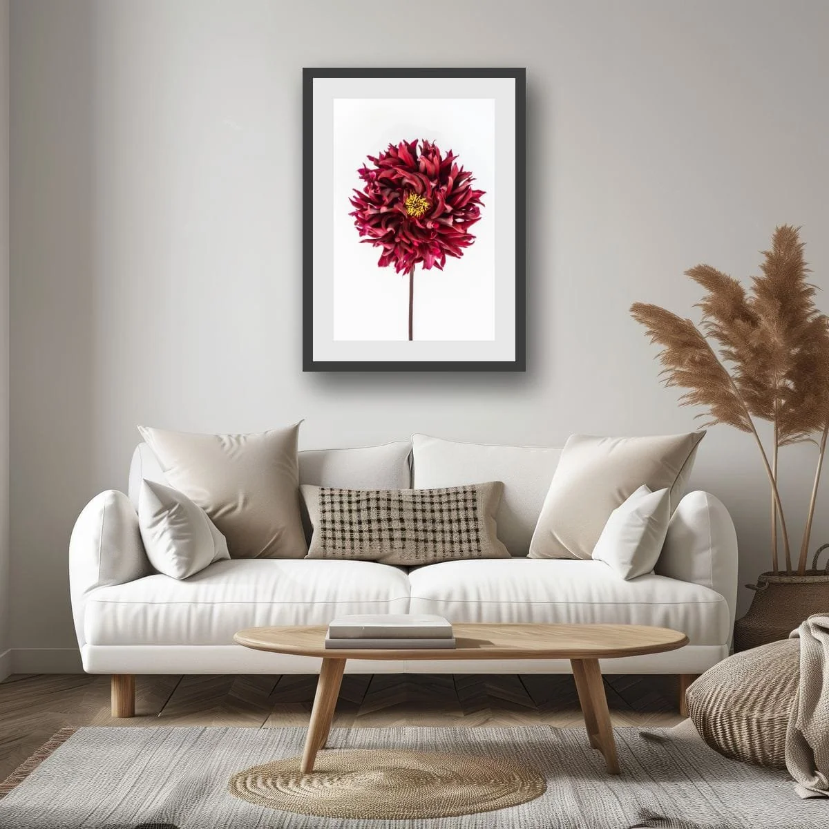 Deep red dahlia flower with layered petals on a soft white background.