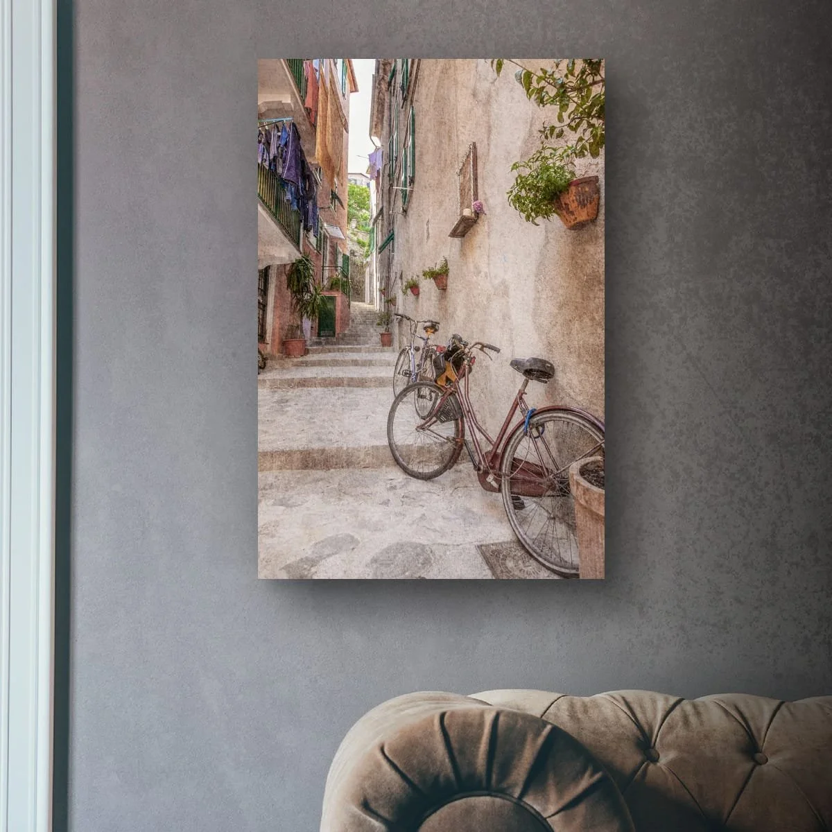 Italian laneway with bicycles, steps and flower pots.
