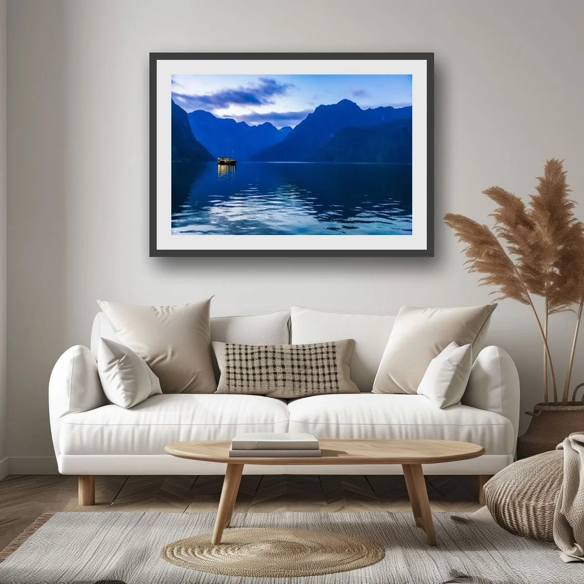 Boat illuminated on Milford Sound during blue hour.