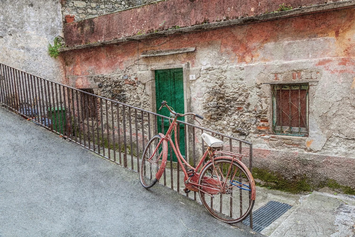 Vintage bicycle beside an old stone wall