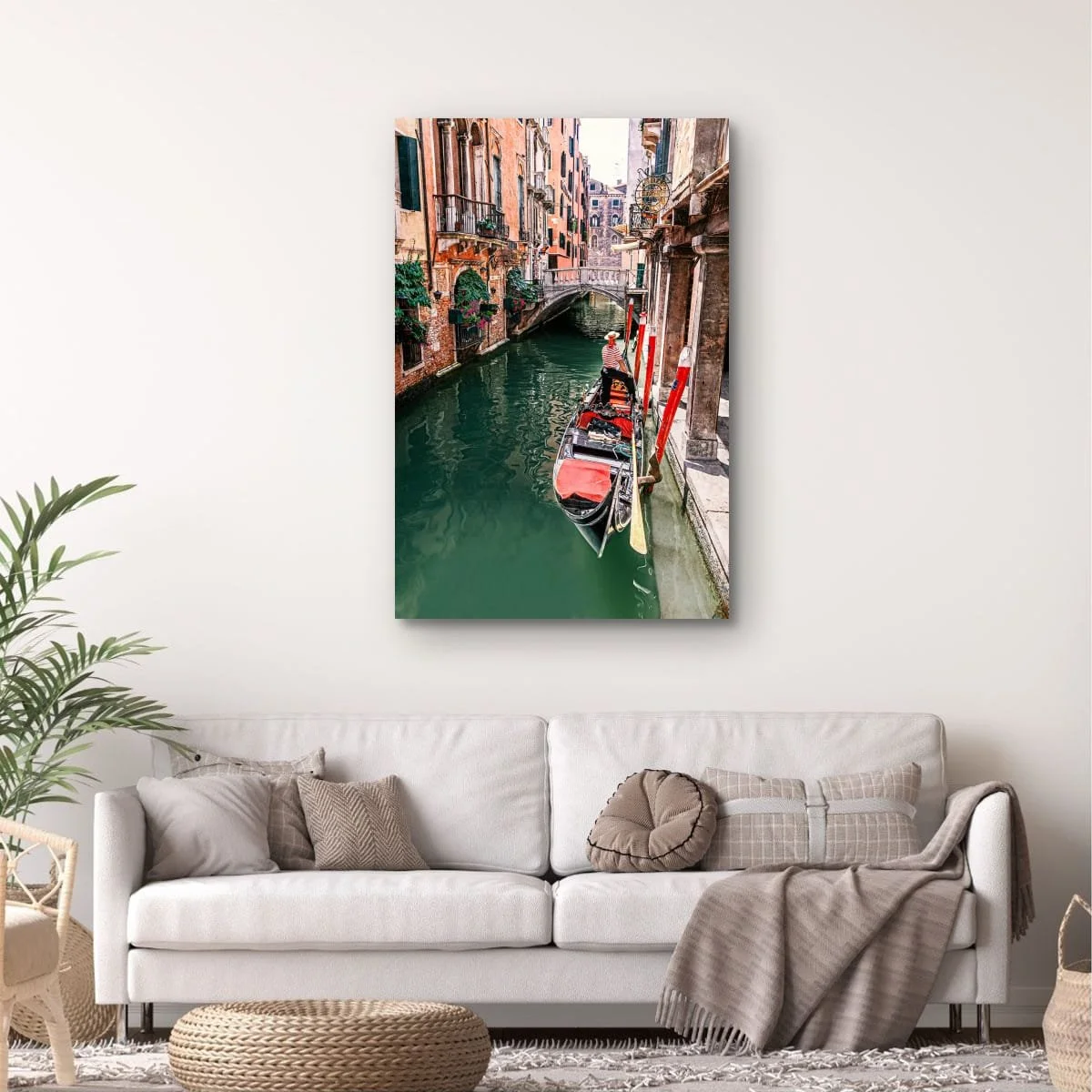 Gondola travelling through a Venetian canal surrounded by historic buildings.