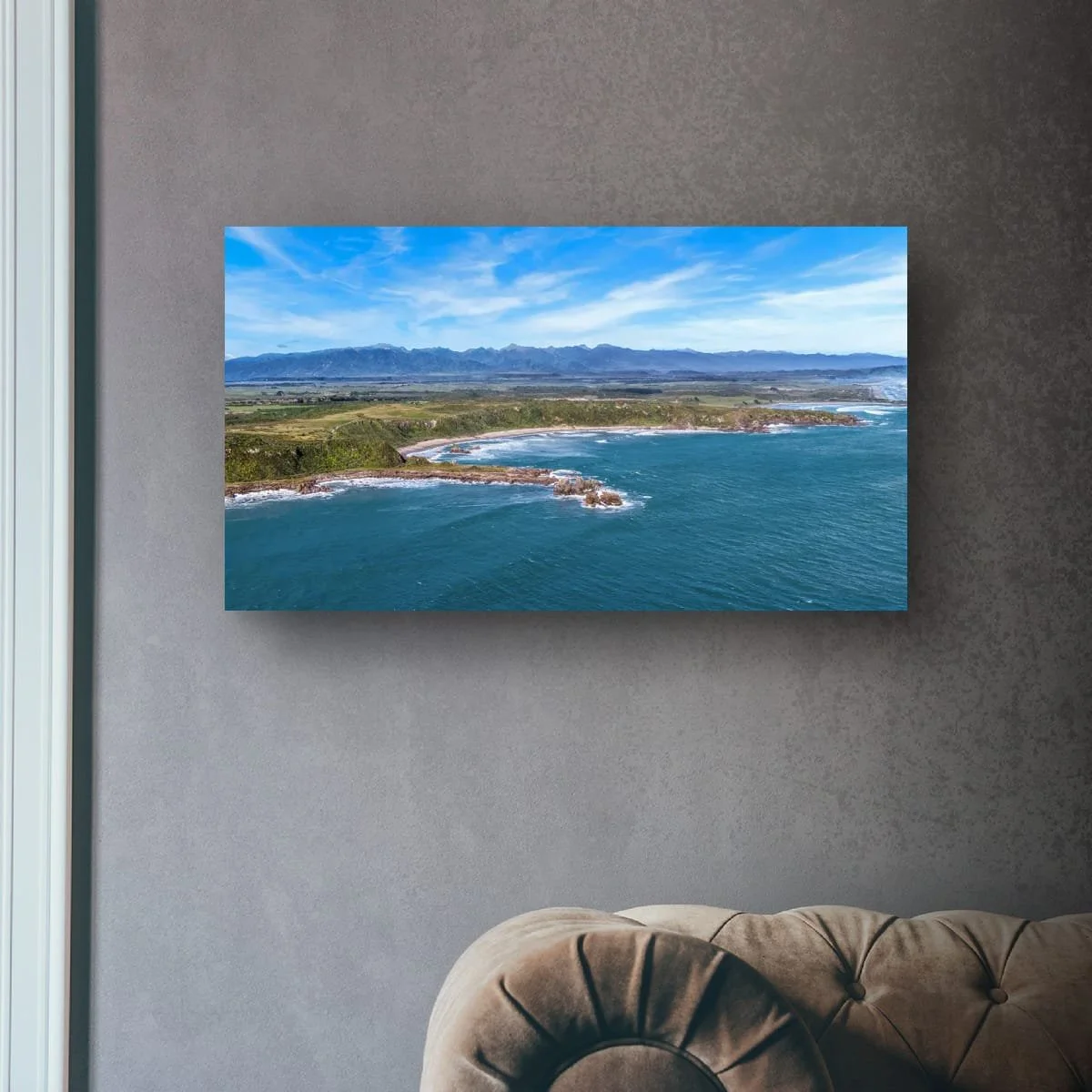 Aerial view of West Coast bays, headlands and mountain ranges.