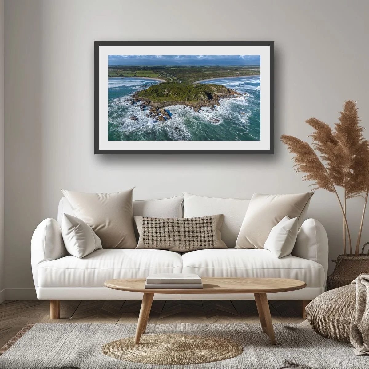 Aerial view of Cape Foulwind surrounded by ocean.