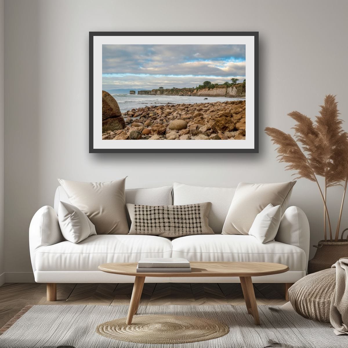 Rocky shoreline leading to limestone cliffs on New Zealand's West Coast.