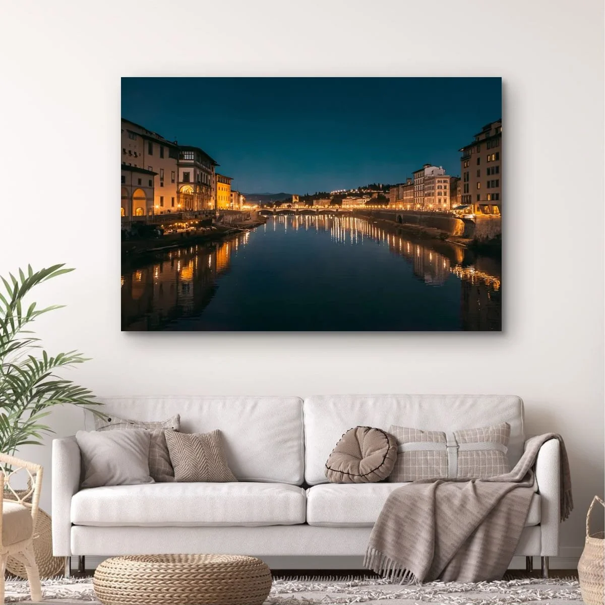 Night view of Florence illuminated along the Arno River.