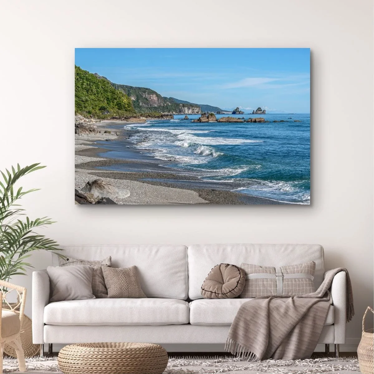 West Coast shoreline with waves, sea stacks and distant mountains.