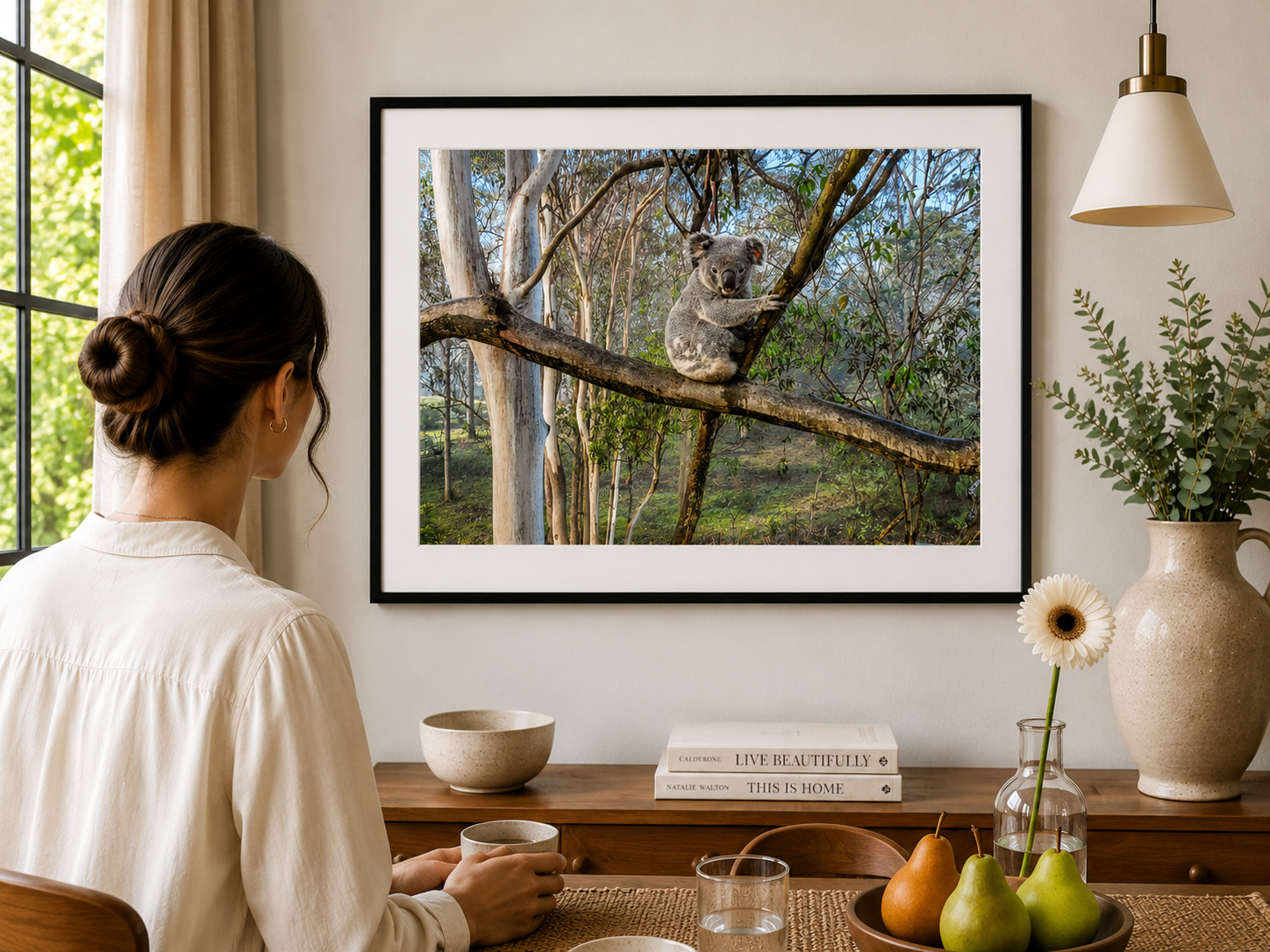Koala hidden among eucalyptus branches and leaves.