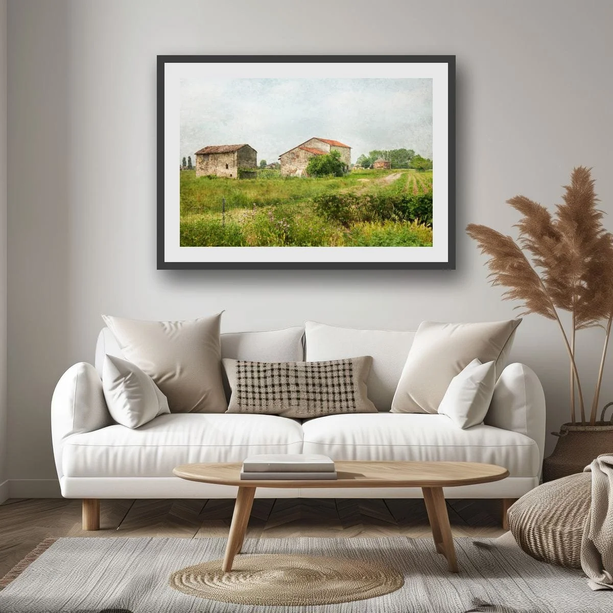 Rustic Italian farm buildings surrounded by green fields.