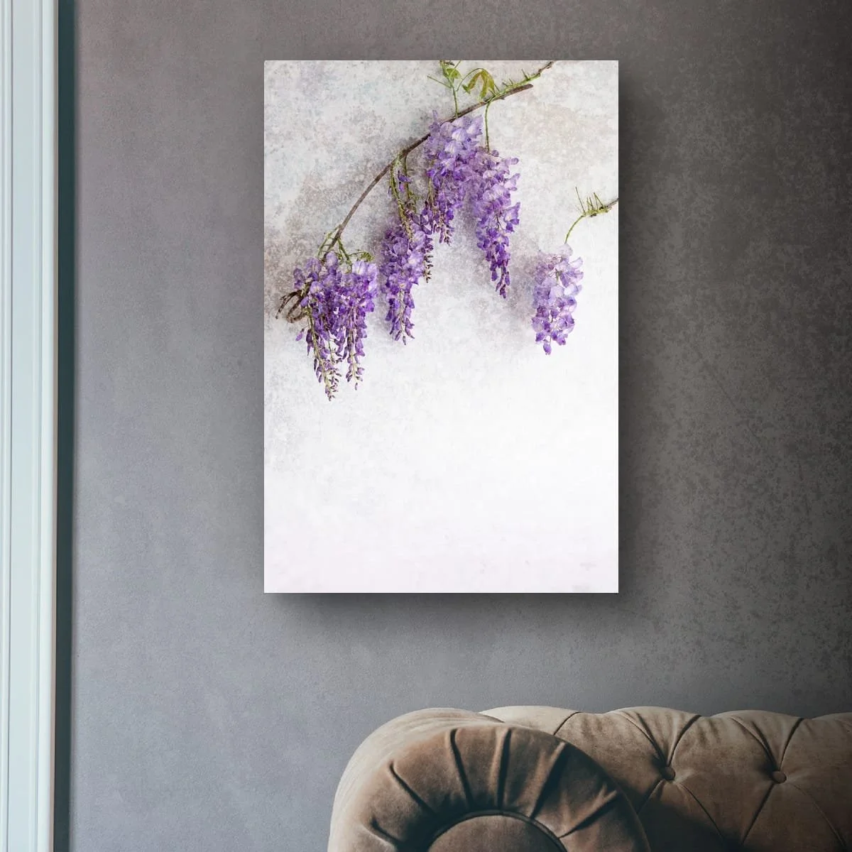 Cascading purple wisteria flowers against a pale backdrop.