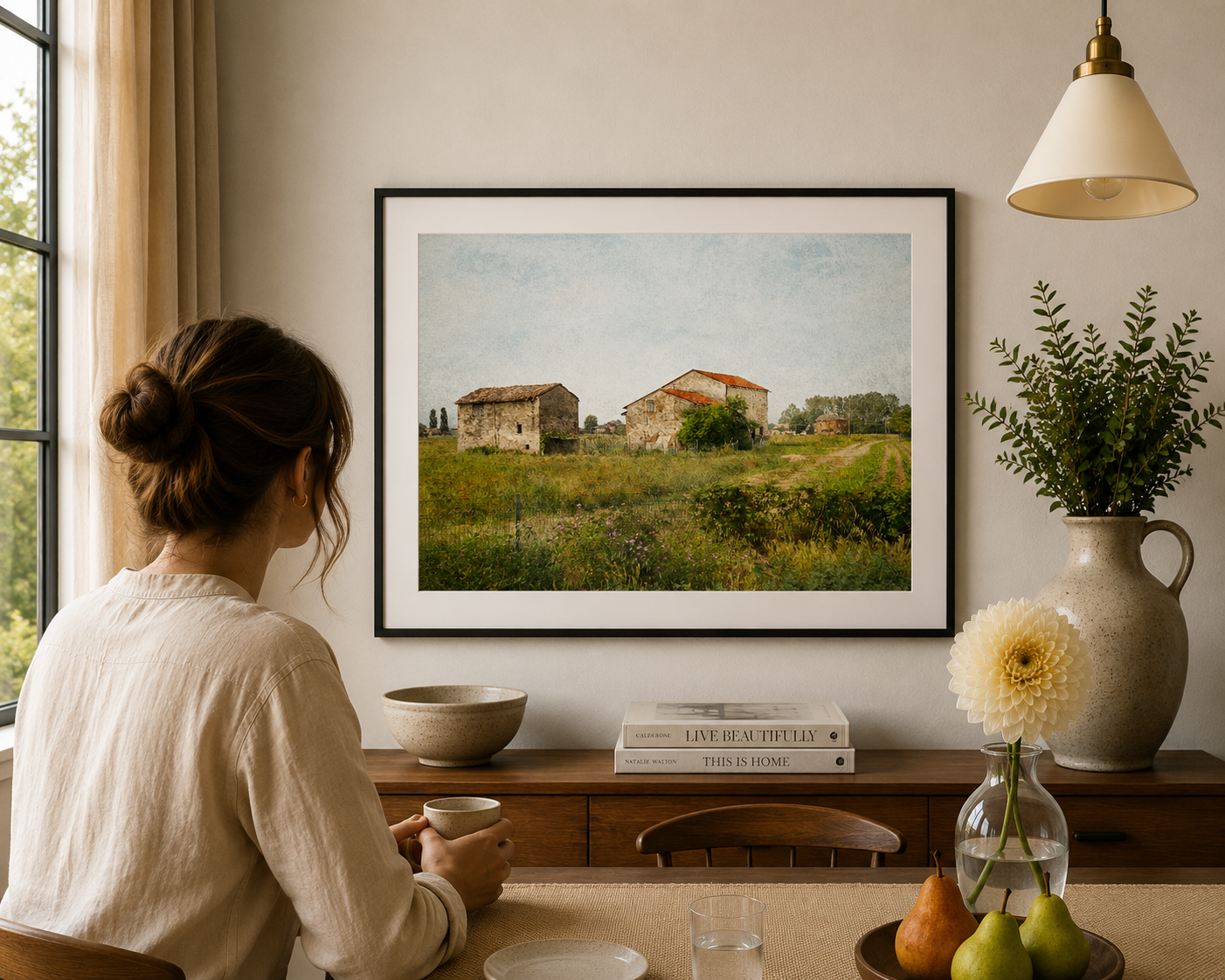 Rustic Italian farm buildings surrounded by green fields.