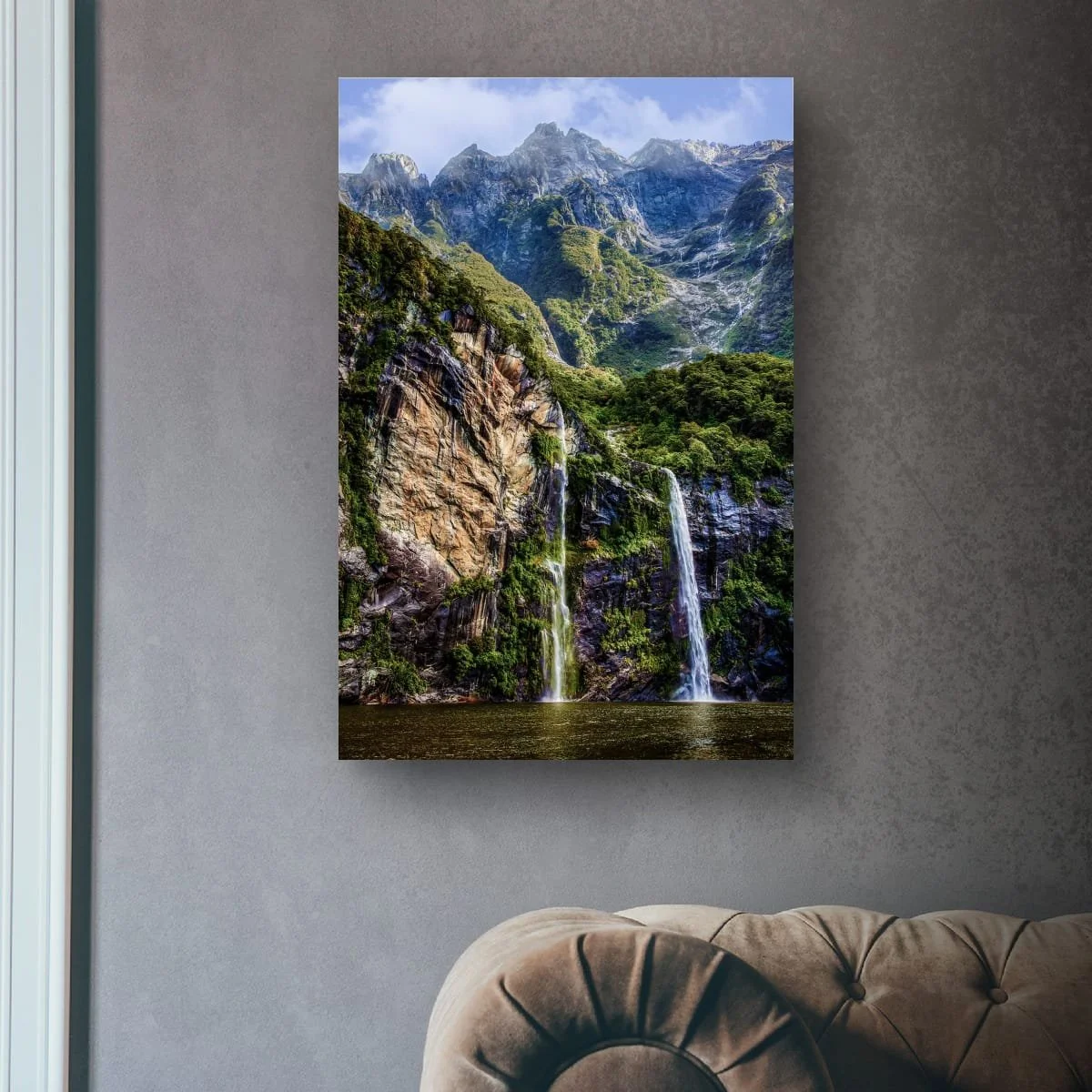 Waterfalls and mountains rising above Milford Sound.