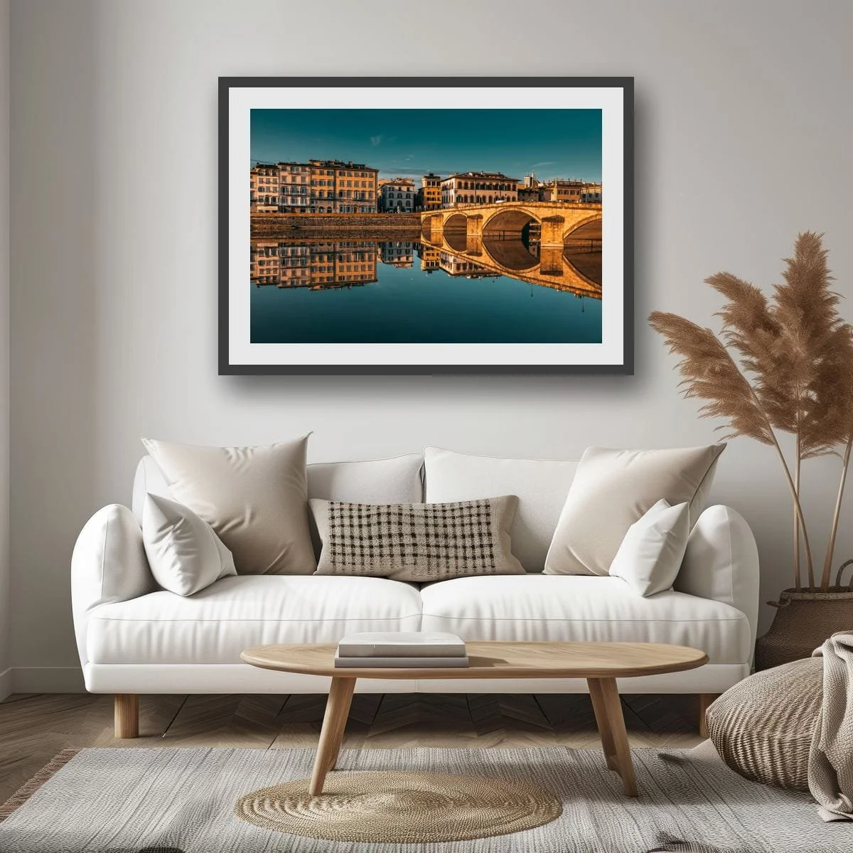 Florence bridge reflected in the Arno River at golden hour, Italy.