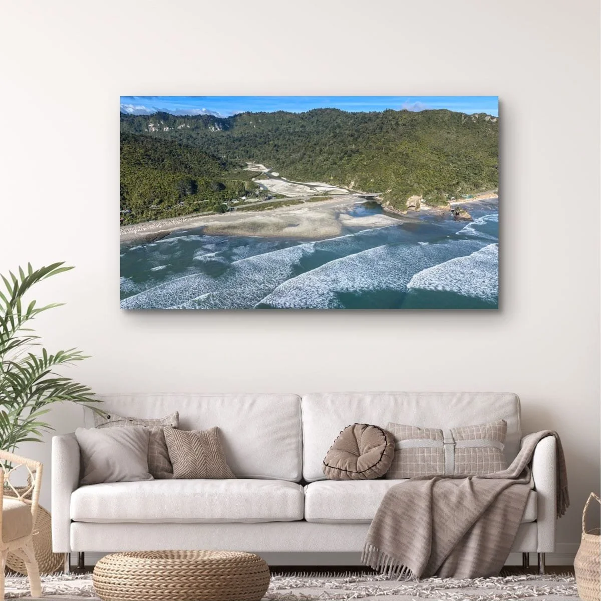 Aerial view of river mouth meeting the Tasman Sea on the West Coast.
