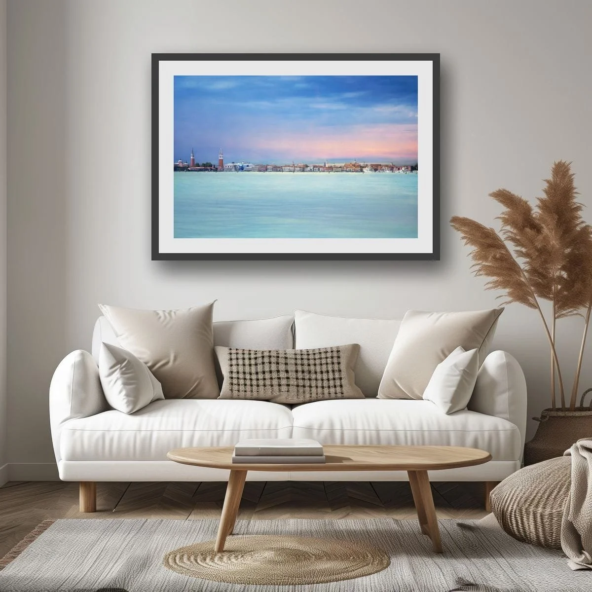 Panoramic view of Venice skyline across calm water beneath pastel skies.